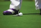 Person golfing