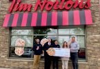 Grip in front of Tim Horton’s with cheque