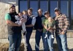 DeBoer family in front of their market store