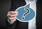 Man holding question mark
