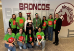 Lesley Kennedy and staff and Bronco family In Christmas colours