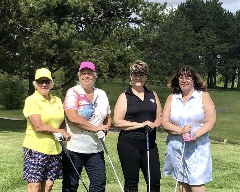 Linda Ford with other golfers